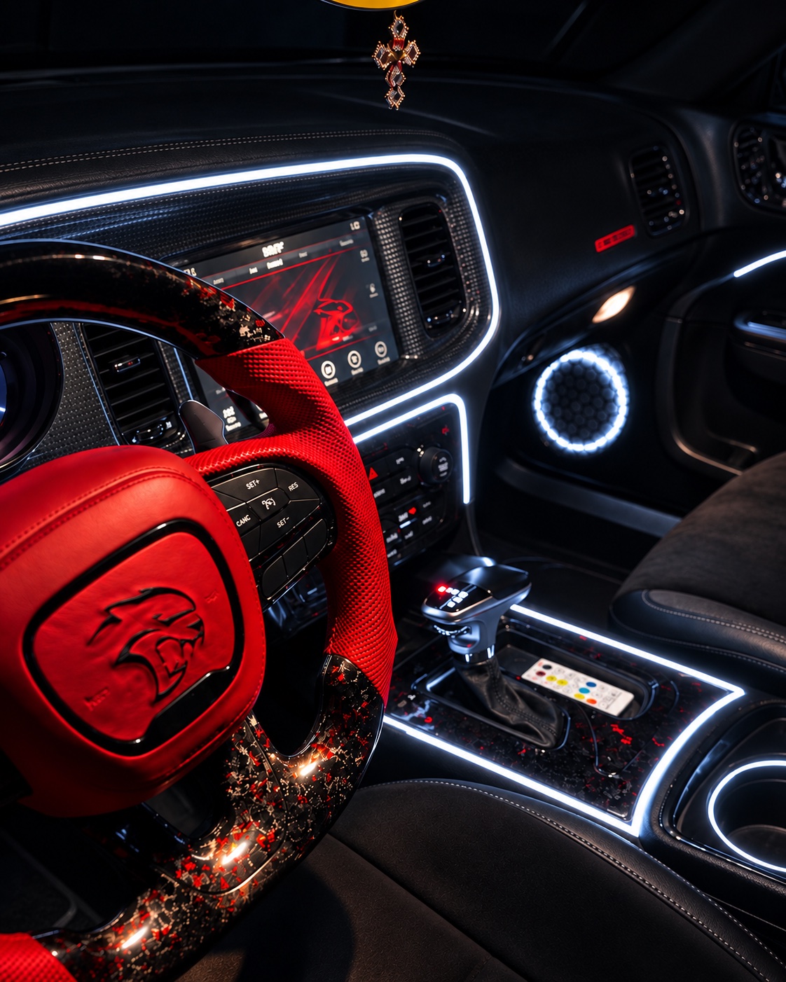 White lighting around the dashboard, console and door speaker beside a red steering wheel